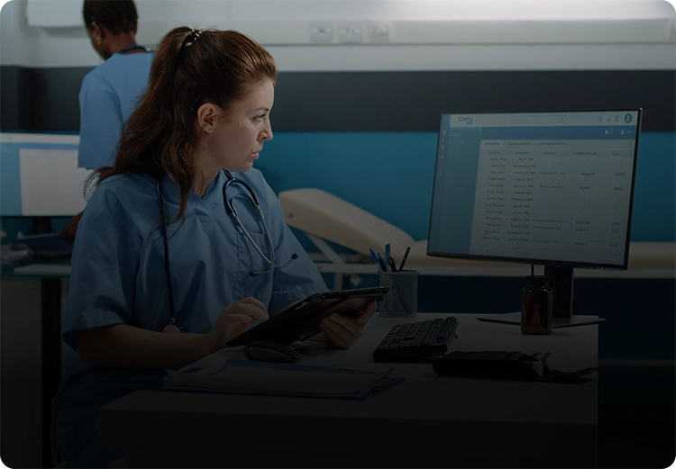 Medical professional at a computer